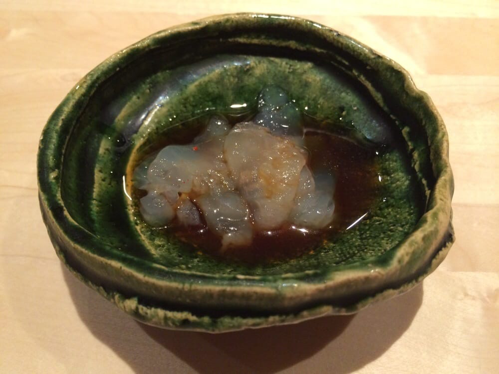 Dish of thinly sliced jellyfish sashimi